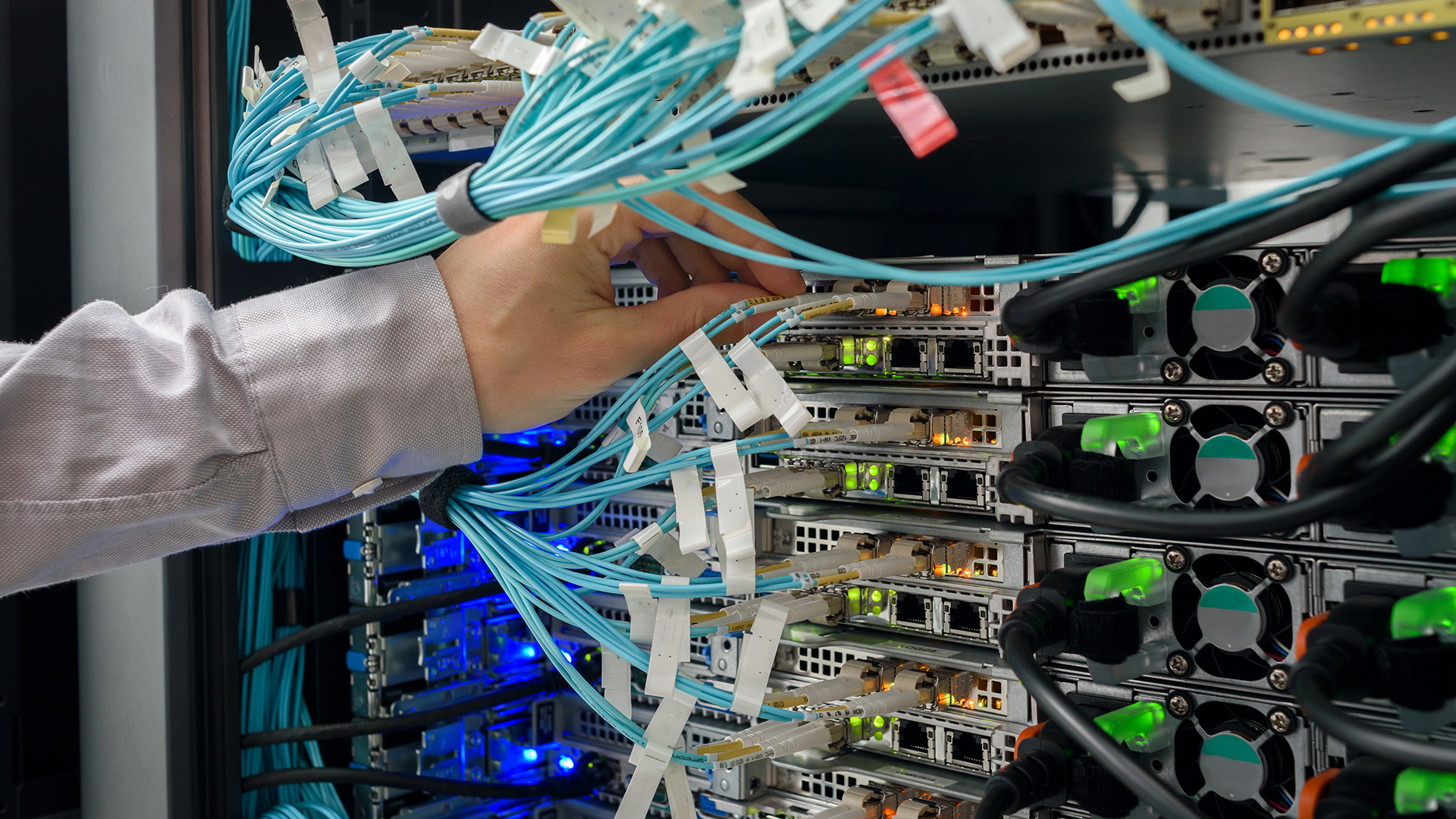 Man data center technician performing server maintenance